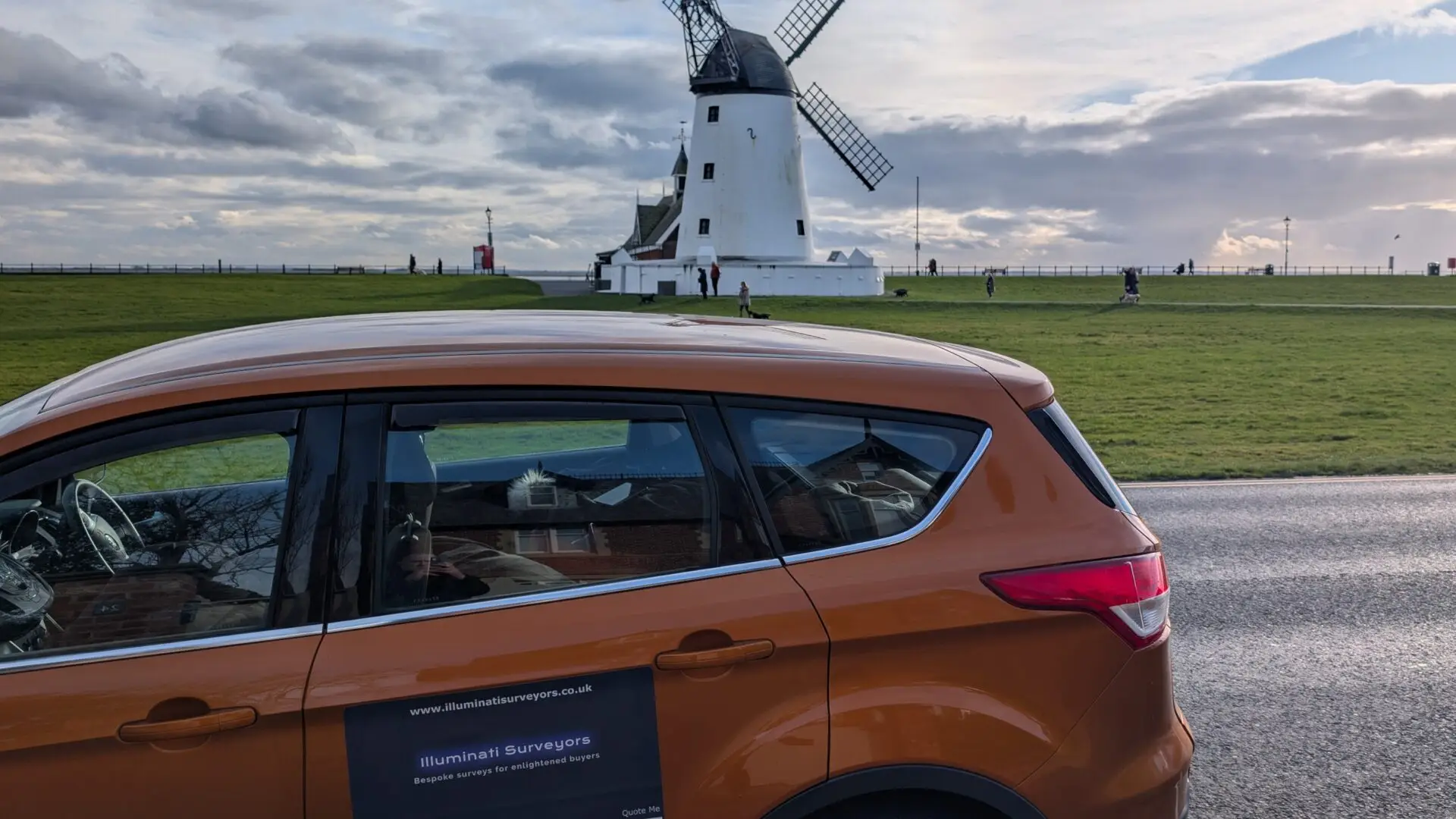 Surveyors Lytham Illuminati Surveyors vehicle beside Lytham Windmill